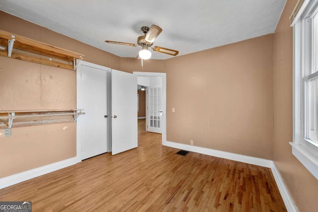 340 Lavista Dr, Blue Ridge, GA 30513 - unfurnished bedroom with visible vents, baseboards, french doors, and wood finished floors
