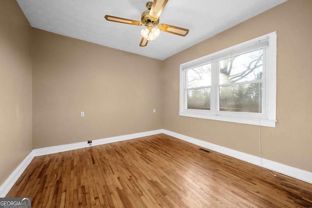 340 Lavista Dr, Blue Ridge, GA 30513 - empty room with wood finished floors, baseboards, a ceiling fan, and visible vents