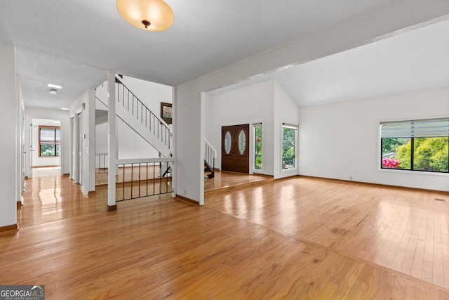 890 Muirfield Rdg, Marietta, GA 30068 - unfurnished living room with a wealth of natural light, light wood finished floors, and baseboards