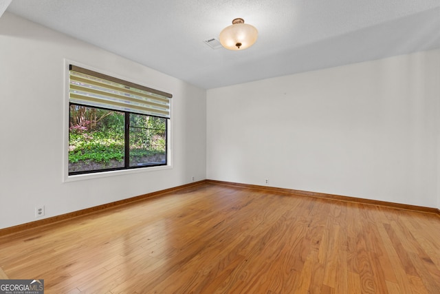 890 Muirfield Rdg, Marietta, GA 30068 - empty room with visible vents, baseboards, and light wood finished floors
