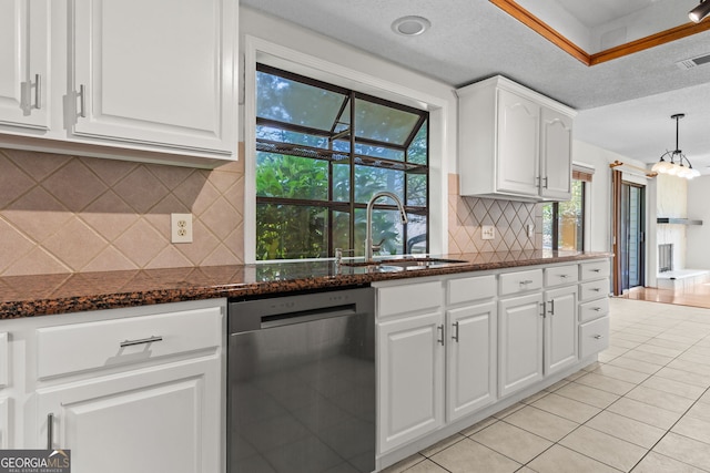 890 Muirfield Rdg, Marietta, GA 30068 - kitchen featuring light tile patterned floors, white cabinetry, dark stone counters, stainless steel dishwasher, and a sink