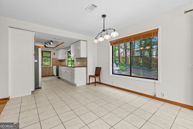 890 Muirfield Rdg, Marietta, GA 30068 - kitchen with freestanding refrigerator, a tray ceiling, visible vents, white cabinets, and dark countertops