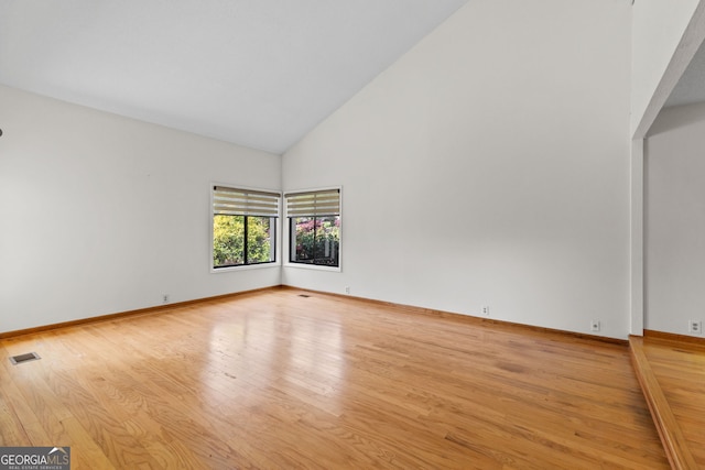890 Muirfield Rdg, Marietta, GA 30068 - unfurnished room featuring wood finished floors, high vaulted ceiling, baseboards, and visible vents
