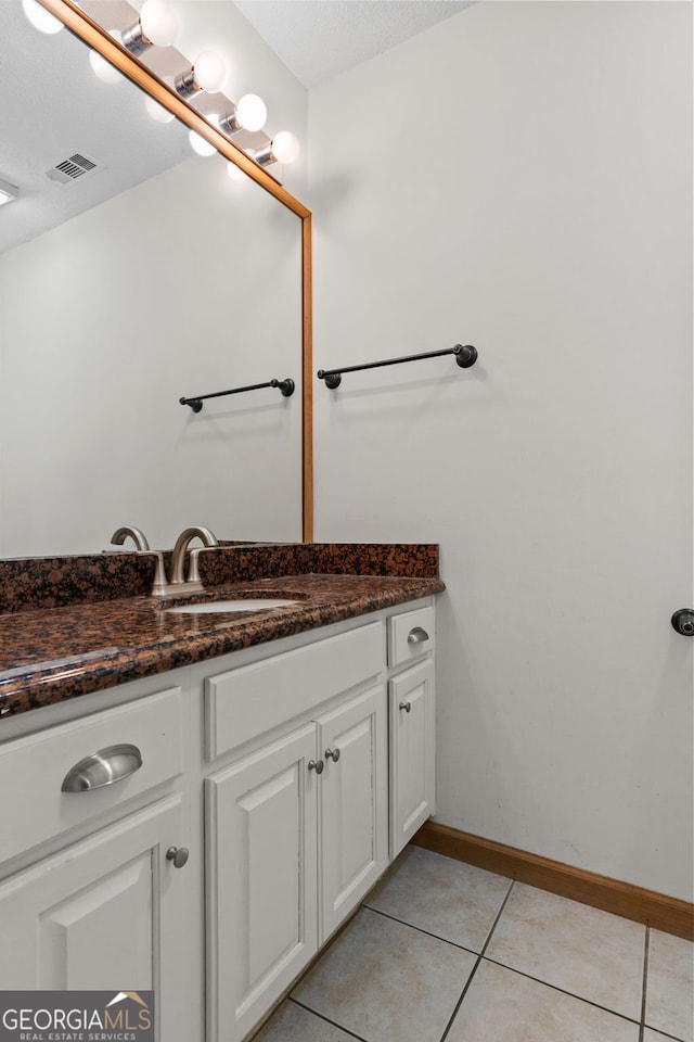 890 Muirfield Rdg, Marietta, GA 30068 - bathroom with a textured ceiling, vanity, visible vents, tile patterned floors, and baseboards