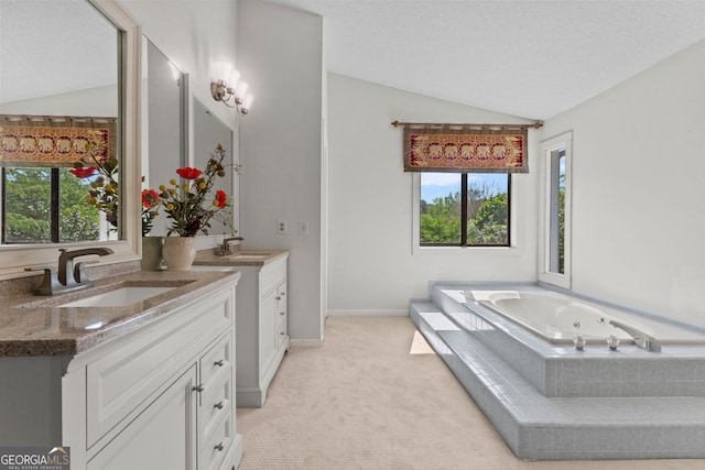 890 Muirfield Rdg, Marietta, GA 30068 - bathroom with two vanities, a sink, lofted ceiling, and a wealth of natural light