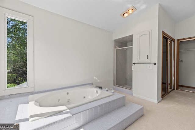 890 Muirfield Rdg, Marietta, GA 30068 - full bathroom with baseboards, a shower stall, a jetted tub, and lofted ceiling