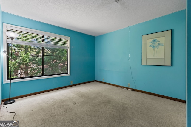 890 Muirfield Rdg, Marietta, GA 30068 - carpeted empty room with a textured ceiling and baseboards