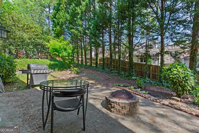 890 Muirfield Rdg, Marietta, GA 30068 - view of patio / terrace with fence, a fire pit, and area for grilling