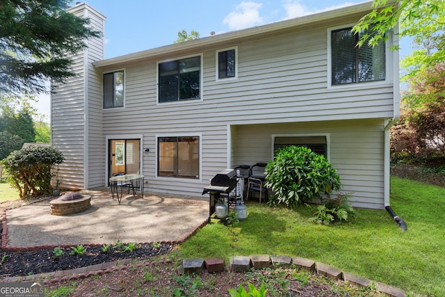 890 Muirfield Rdg, Marietta, GA 30068 - back of house featuring a patio area, an outdoor fire pit, a yard, and a chimney