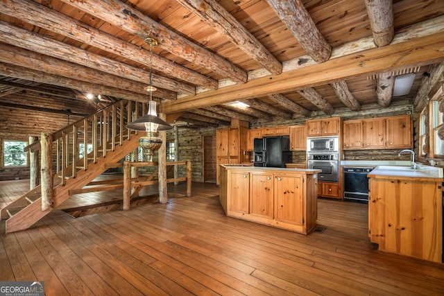 kitchen with a sink, wood ceiling, dark wood finished floors, beamed ceiling, and black appliances