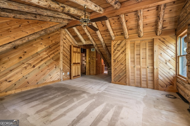bonus room with wood ceiling, wooden walls, lofted ceiling with beams, and a ceiling fan