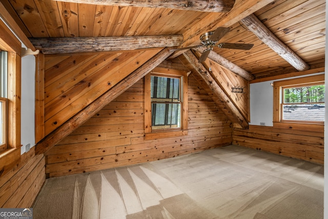 bonus room with wooden ceiling, ceiling fan, wooden walls, carpet floors, and vaulted ceiling with beams