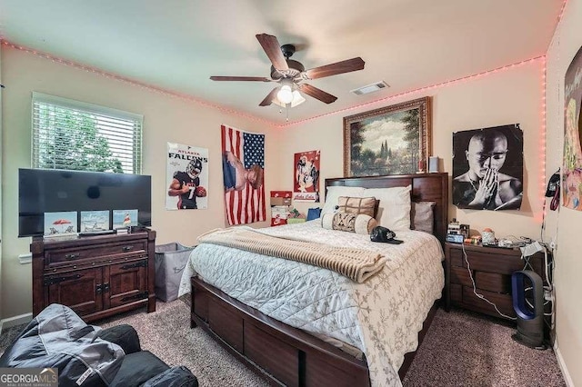 carpeted bedroom featuring visible vents and ceiling fan