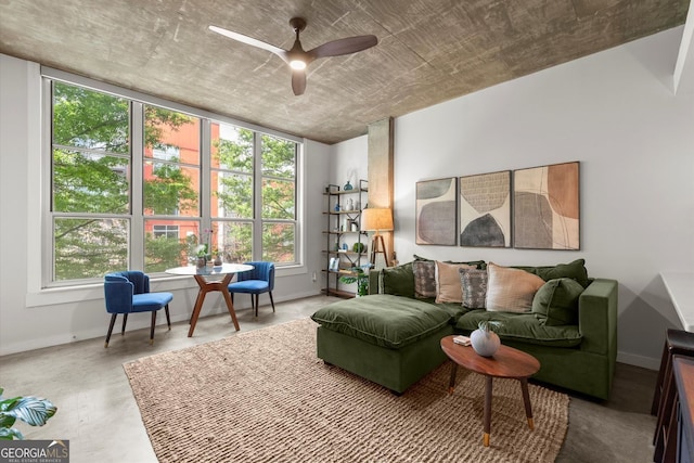 245 N Highland Ave NE Unit 220, Atlanta, GA 30307 - living room with ceiling fan, baseboards, and concrete floors
