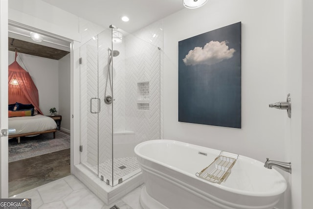 245 N Highland Ave NE Unit 220, Atlanta, GA 30307 - ensuite bathroom featuring a freestanding tub, a shower stall, and recessed lighting