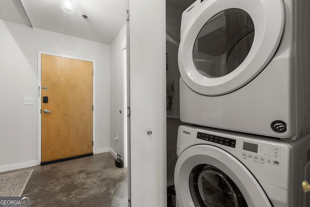 245 N Highland Ave NE Unit 220, Atlanta, GA 30307 - laundry room with stacked washer / drying machine and baseboards