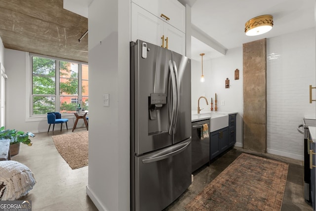 245 N Highland Ave NE Unit 220, Atlanta, GA 30307 - kitchen with stainless steel appliances, a sink, white cabinetry, and baseboards