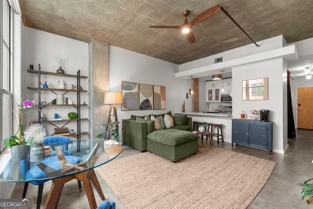245 N Highland Ave NE Unit 220, Atlanta, GA 30307 - living room with a ceiling fan and finished concrete flooring