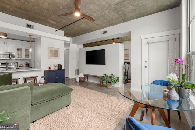 245 N Highland Ave NE Unit 220, Atlanta, GA 30307 - living room with a ceiling fan and concrete flooring