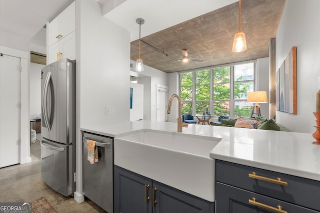 245 N Highland Ave NE Unit 220, Atlanta, GA 30307 - kitchen with stainless steel appliances, concrete flooring, a sink, pendant lighting, and light countertops