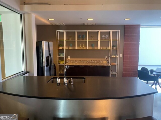 245 N Highland Ave NE Unit 220, Atlanta, GA 30307 - kitchen featuring stainless steel refrigerator with ice dispenser, a sink, and recessed lighting