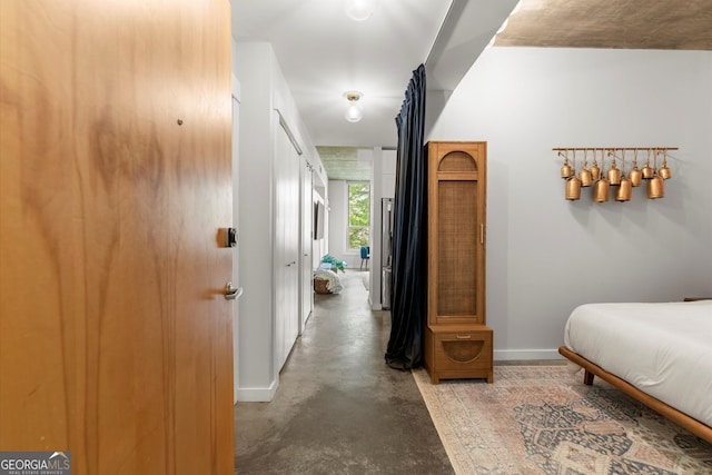 245 N Highland Ave NE Unit 220, Atlanta, GA 30307 - bedroom featuring finished concrete floors and baseboards