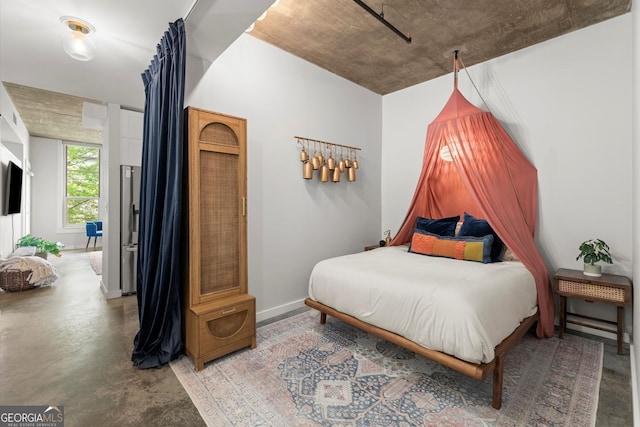245 N Highland Ave NE Unit 220, Atlanta, GA 30307 - bedroom featuring finished concrete flooring and baseboards