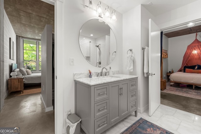 245 N Highland Ave NE Unit 220, Atlanta, GA 30307 - ensuite bathroom with vanity, baseboards, concrete floors, and a shower