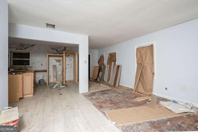 unfurnished living room featuring light wood-style flooring