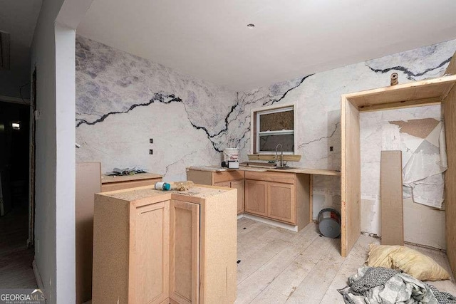 interior space with a sink and light wood-type flooring
