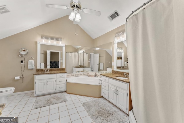 full bathroom with tile patterned floors, ceiling fan, a bath, lofted ceiling, and two vanities