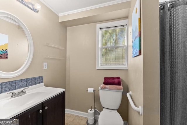 bathroom featuring crown molding, baseboards, vanity, toilet, and tile patterned flooring
