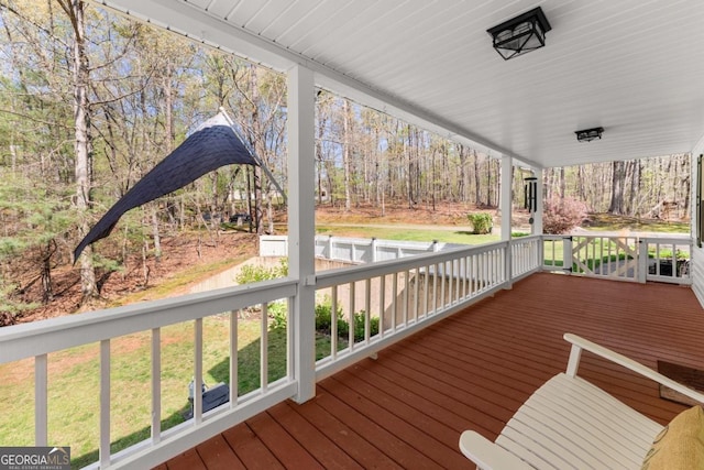 wooden terrace featuring a porch