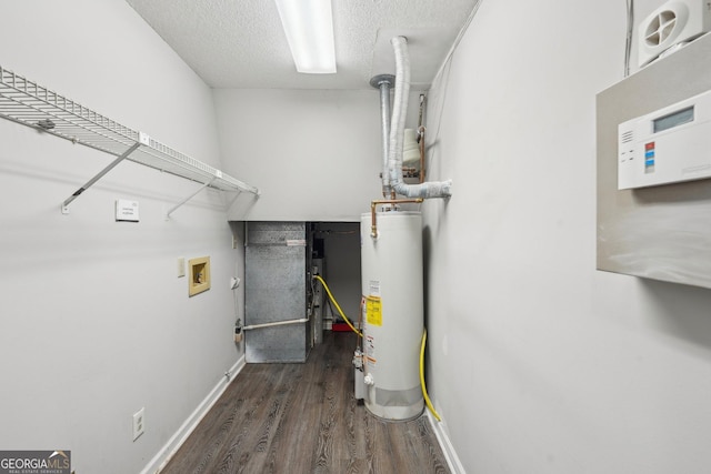 utility room featuring water heater