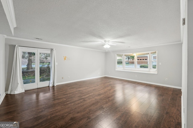 empty room featuring dark wood-style floors, a textured ceiling, ornamental molding, and ceiling fan