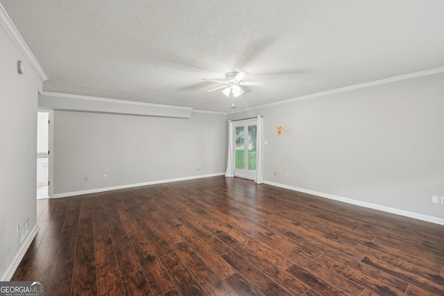 spare room featuring dark wood-style floors, a textured ceiling, ornamental molding, and a ceiling fan