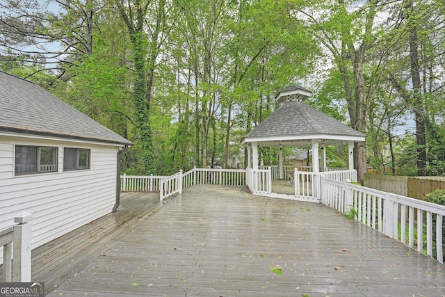 deck featuring a gazebo and fence