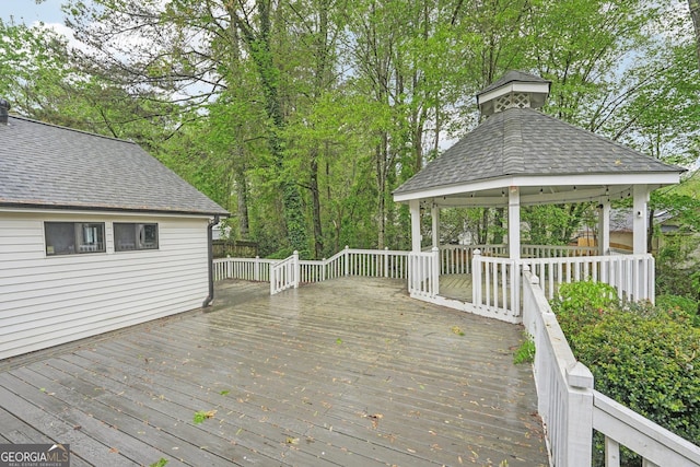 wooden terrace featuring a gazebo