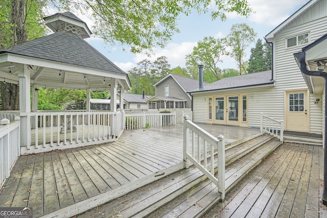 deck featuring french doors and a gazebo
