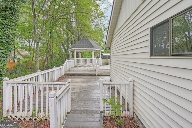 wooden deck with a gazebo and stairway