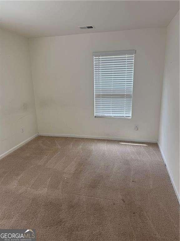 184 Grafton St, Hampton, GA 30228 - unfurnished room with visible vents, baseboards, and carpet