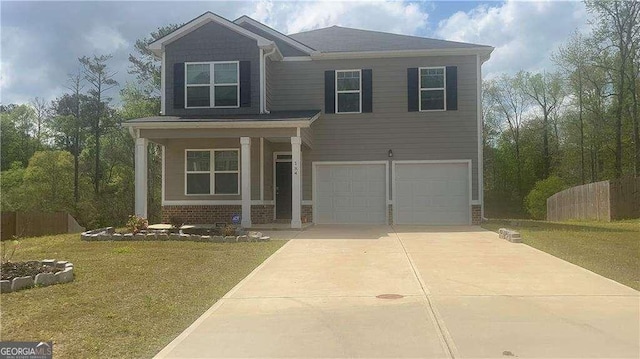 184 Grafton St, Hampton, GA 30228 - view of front of house with concrete driveway, a front lawn, an attached garage, brick siding, and fence