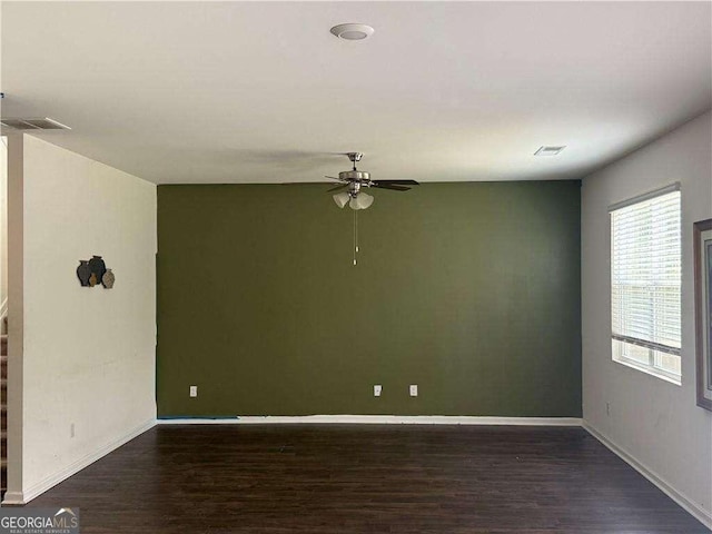 184 Grafton St, Hampton, GA 30228 - empty room with wood finished floors, ceiling fan, baseboards, and visible vents
