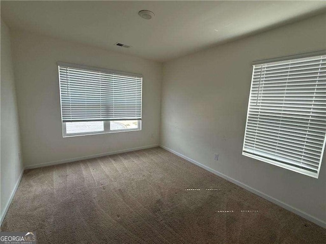 184 Grafton St, Hampton, GA 30228 - carpeted empty room with baseboards and visible vents