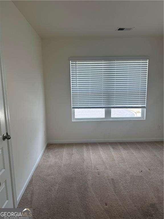 184 Grafton St, Hampton, GA 30228 - carpeted empty room featuring baseboards