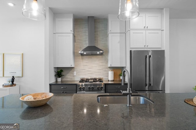 2614 Talley St, Decatur, GA 30030 - kitchen with wall chimney range hood, high quality fridge, tasteful backsplash, a sink, and gas range