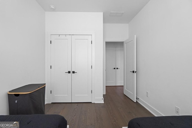 2614 Talley St, Decatur, GA 30030 - bedroom featuring baseboards, wood finished floors, and a closet