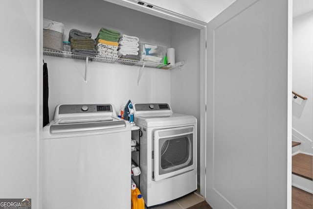 2614 Talley St, Decatur, GA 30030 - washroom with wood finished floors, separate washer and dryer, and laundry area
