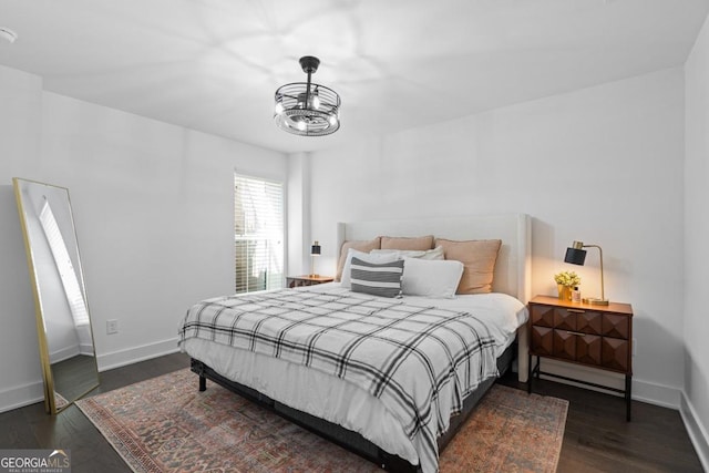 2614 Talley St, Decatur, GA 30030 - bedroom featuring a chandelier, wood finished floors, and baseboards
