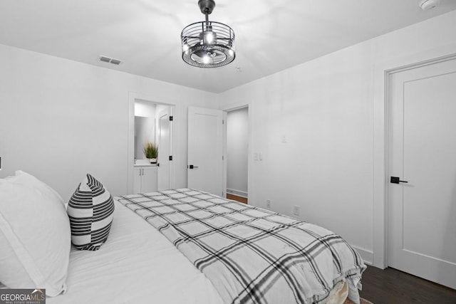 2614 Talley St, Decatur, GA 30030 - bedroom with dark wood finished floors, visible vents, and ensuite bathroom